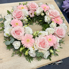 Round funeral wreath with pink natural flowers 60 cm