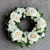 Round funeral wreath with natural flowers
