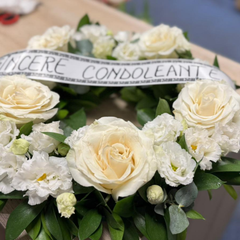 Round funeral wreath with natural flowers