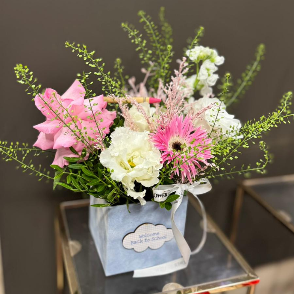 "Sense" arrangement with roses and lisianthus