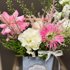 "Sense" arrangement with roses and lisianthus