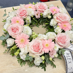 Round funeral wreath with pink natural flowers 60 cm