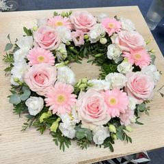 Round funeral wreath with pink natural flowers 60 cm